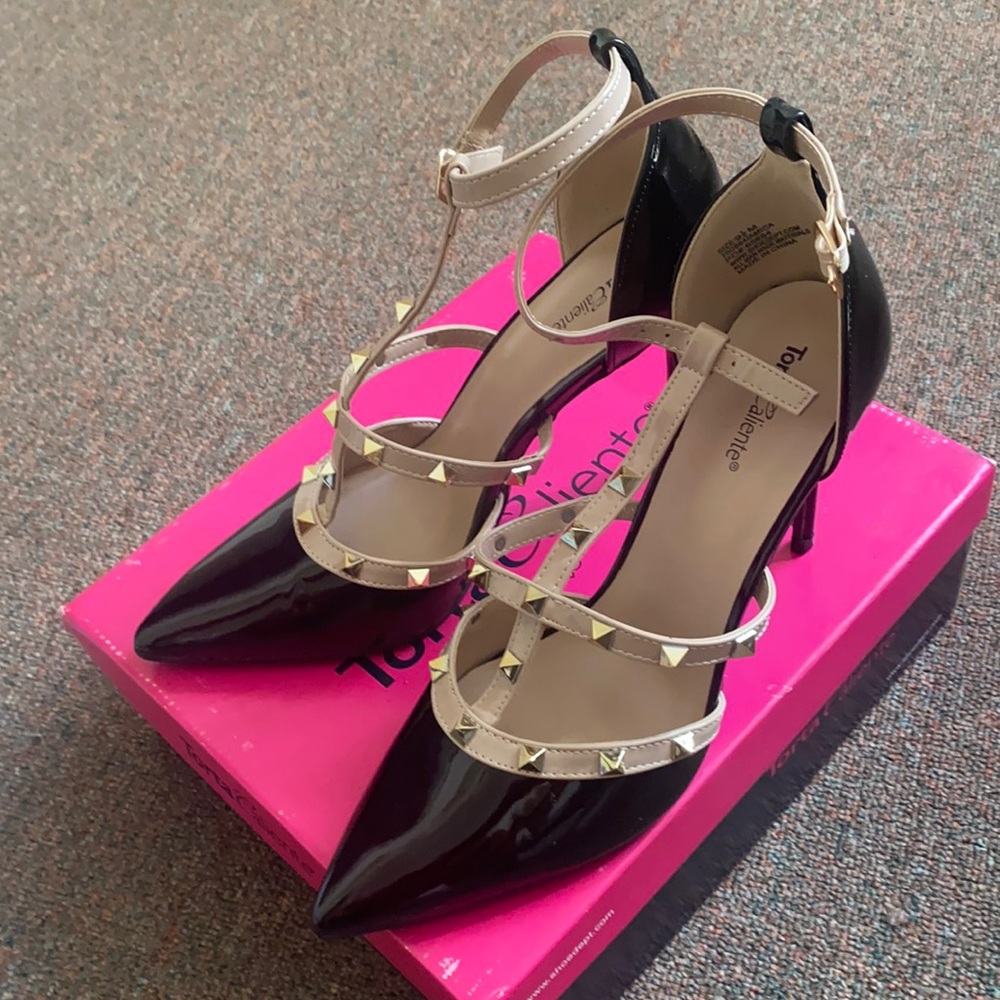 Black and Beige studded heels. Size 9.5. Worn once.